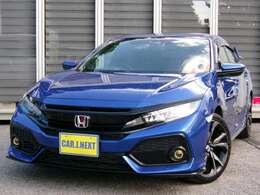 ブリリアントスポーティブルーメタリックのFK7シビックハッチバックが入庫しました！HKSリーガマックスプレミアムマフラーに大型リアスポイラーを装着！スタイリッシュに決まった一台です！当社お薦めの一台！