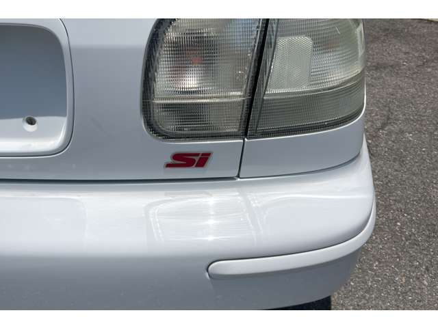Si