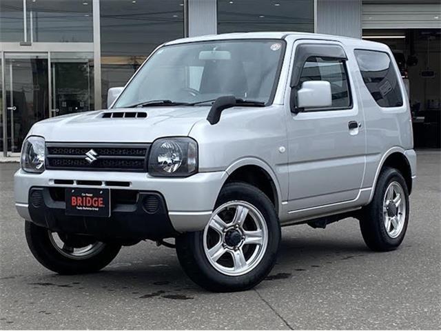 スズキ　ジムニー　XG　4WD/オートマ車/社外フルセグナビゲーション/背面タイヤあり/ヘッドライトレベライザー/ワイヤレスキー/社外アルミホイール