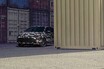 最強カローラことGRバージョンをトヨタがチラ見せ。画面中央ではなく左隅に佇む謎の車両に注目