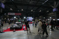 入口の大迫力なレーシングカー展示は「オートメッセ」名物！　　「スーパーGT」ブースは３台のGT500マシンで来場者をお出迎え【AMA2025】