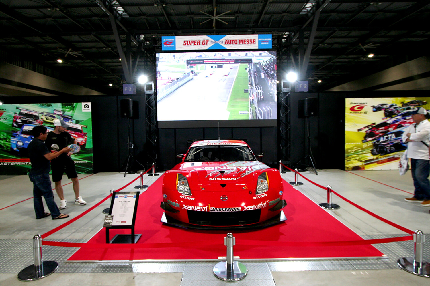 入口の大迫力なレーシングカー展示は「オートメッセ」名物！　　「スーパーGT」ブースは３台のGT500マシンで来場者をお出迎え【AMA2025】